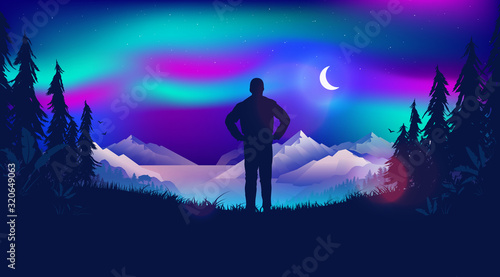 Watching the northern lights. Man standing watching the beautiful view, looking at the night sky and the moon. Lights are dancing over the sky. Scandinavian nature landscape concept.