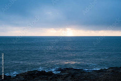 Picture of a seascape during sunset over the Atlantic Ocean  taken during winter.