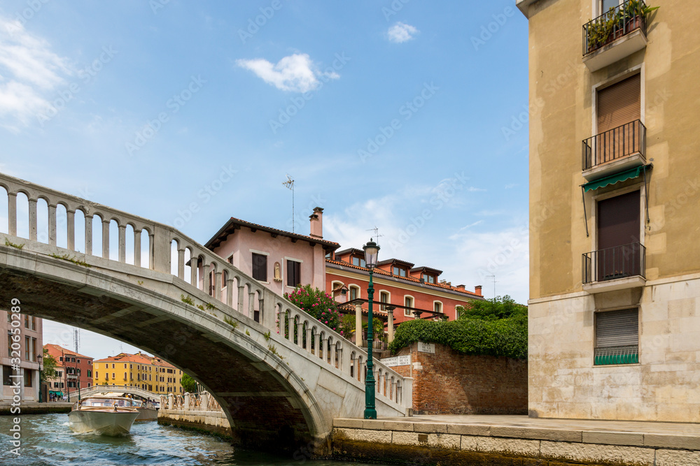 Architecture and facade of the old city buildings and bridges of Venice