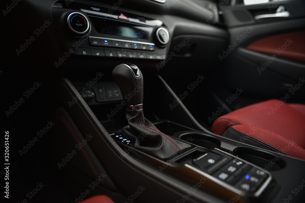 Interior of a car. Cup holders and automatic gearbx shifter.