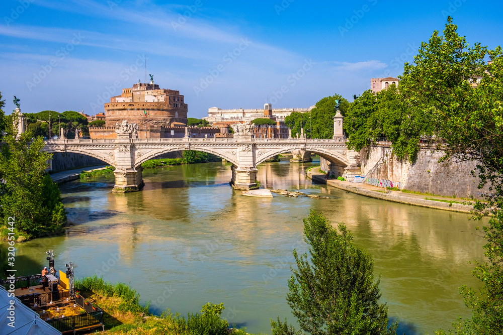 Rome, Italy - Panoramic view of Rome with Castle of St. Angel - Castel Sant’Angelo - and Ponte Vittorio Emanuele II bridge over the Tiber river Rome, Italy - Panoramic view of Rome with Castle of St. Angel - Castel Sant’Angelo - and Ponte Vittorio Emanuele II bridge over the Tiber river