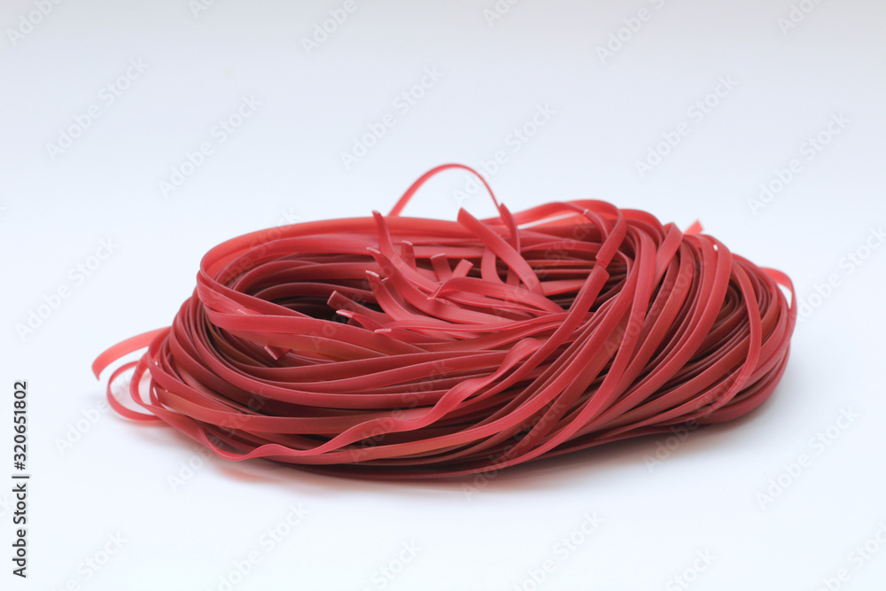 Isolated red spaghetti nest on a white background Isolated red spaghetti nest on a white background