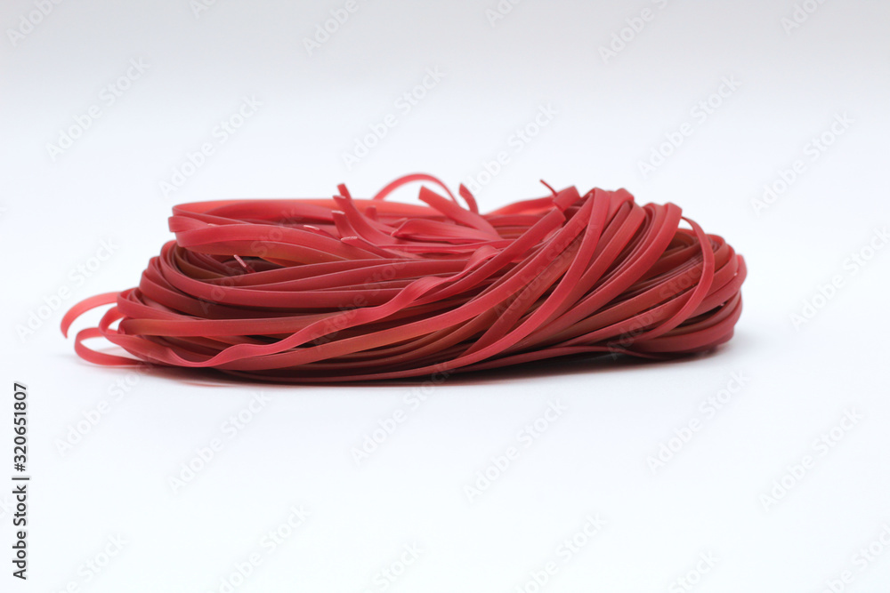 Isolated red spaghetti nest on a white background