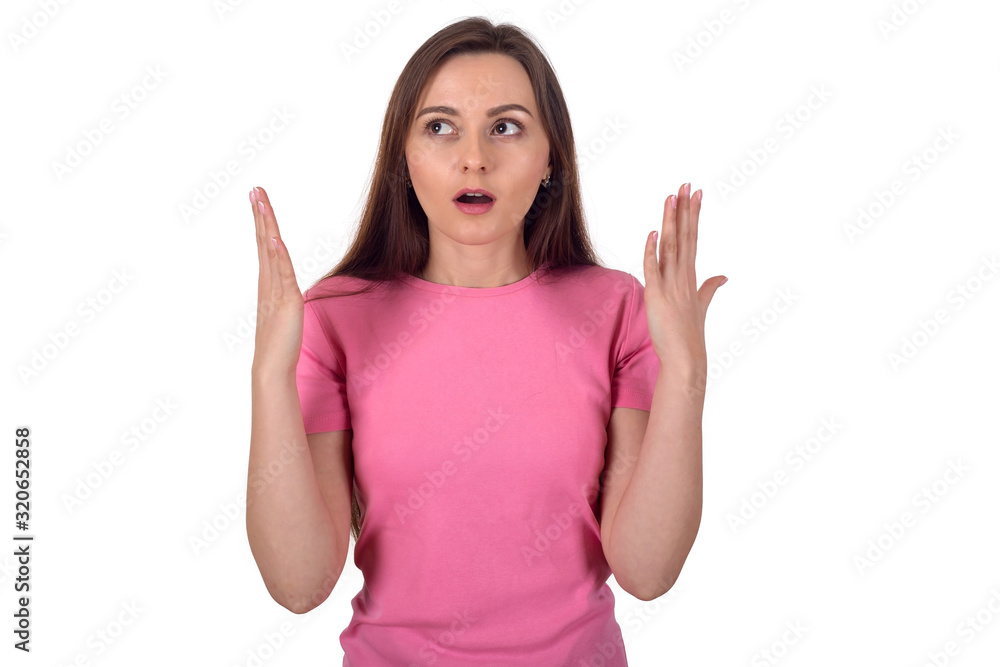 Surprised woman holds hands in front of herself, isolated on a white background. Young female in shock. Surprised woman holds hands in front of herself, isolated on a white background. Young female in shock.