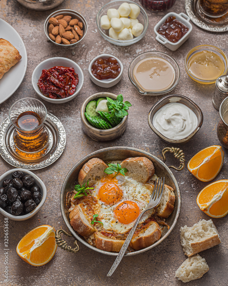 Delicious Turkish breakfast with different appetizers and eggs Delicious Turkish breakfast with different appetizers and eggs