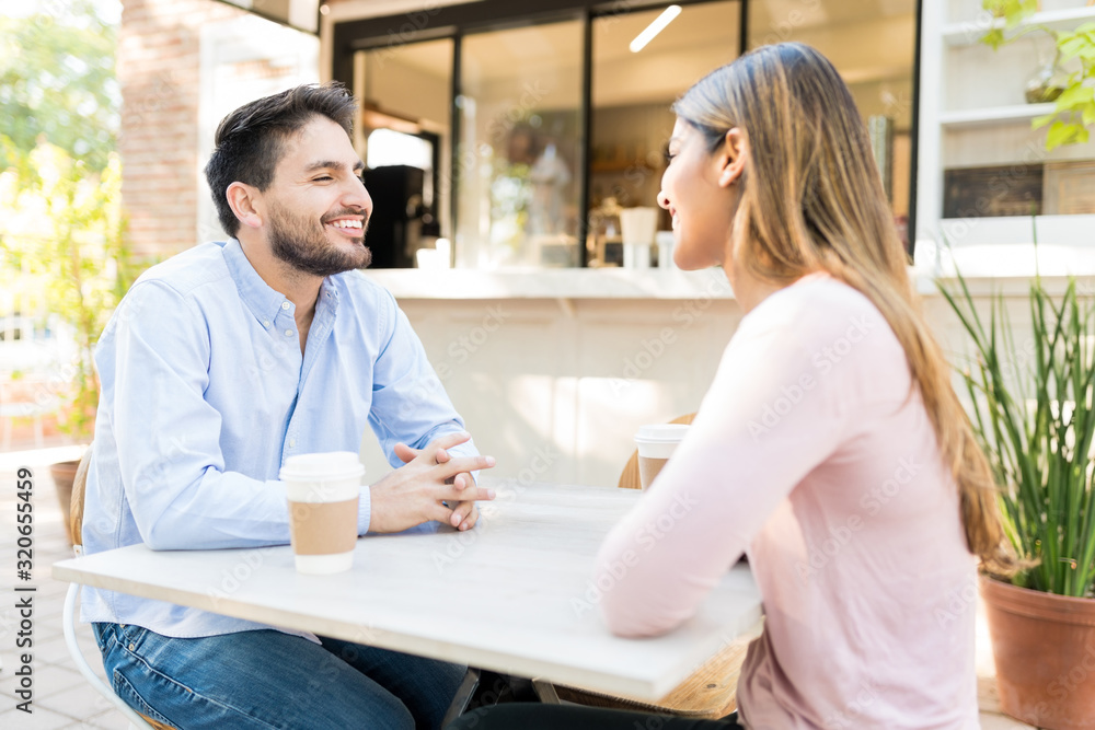Romantic Couple Enjoying Date At Cafe