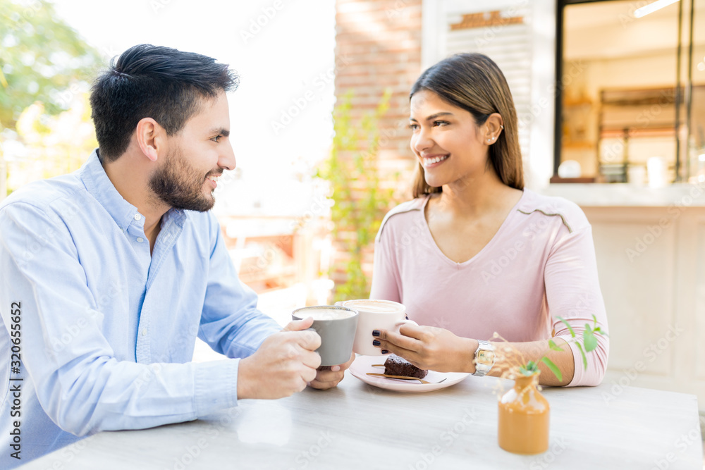Hispanic Couple Having Coffee During Date