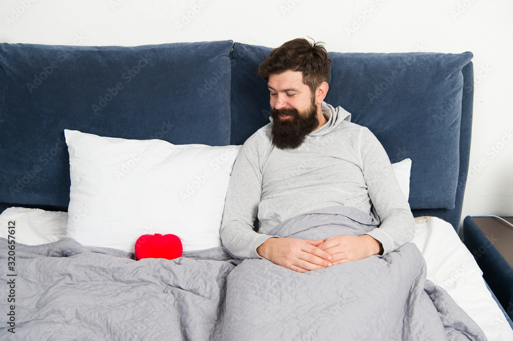 holidays and happiness concept. romantic morning at home. celebrating Saint Valentines Day. who is my valentine. happy hipster relax in bed. Heart filled with love. man feel romance holidays and happiness concept. romantic morning at home. celebrating Saint Valentines Day. who is my valentine. happy hipster relax in bed. Heart filled with love. man feel romance