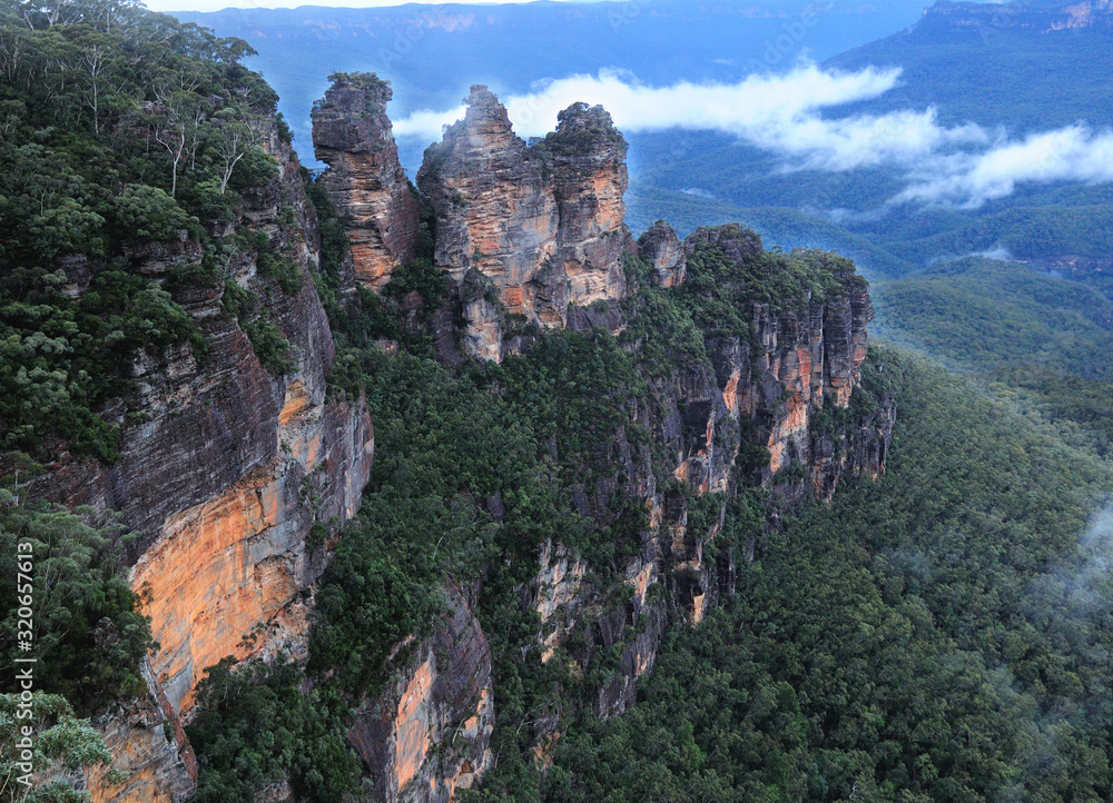 Rock Formation Three Sisters In The Foggy Blue Mountains NSW Australia