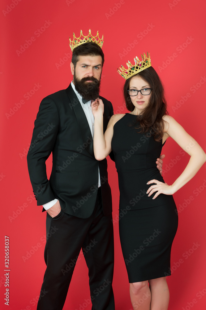 Perfect match. Elite society. Being recognised and proud. Proud couple. Woman and bearded man wear crowns. Selfish egoist. Superiority complex. Fame and popularity. Famous couple. Proud of their love