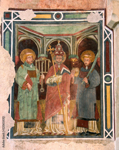 San Lorenzo, San Silvestro e Santo Stefano; affresco nella chiesa di Santa Maria Assunta, Pieve di Fiemme, Cavalese photo