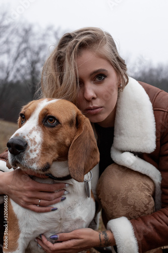 Girl on a walk with dogs in the fall