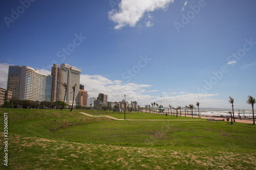Panorama photo of Durban beachfront or cityscape. View from the main pier towards the big city skyscrapers on a sunny day.