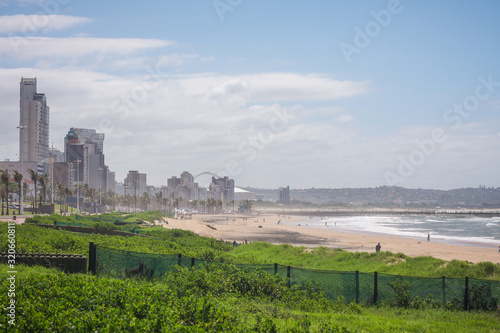 Panorama photo of Durban beachfront or cityscape. View from the gardens towards the big city skyscrapers on a sunny day. © Anze