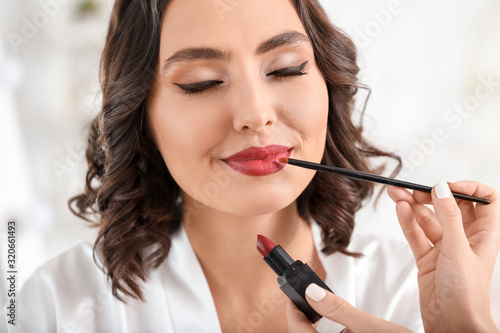 Makeup artist working with ...