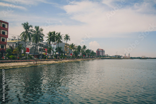 City waterfront of Makassar or Ujung Padang on the island of Sulawesi in eastern Indonesia on an overcast day. photo