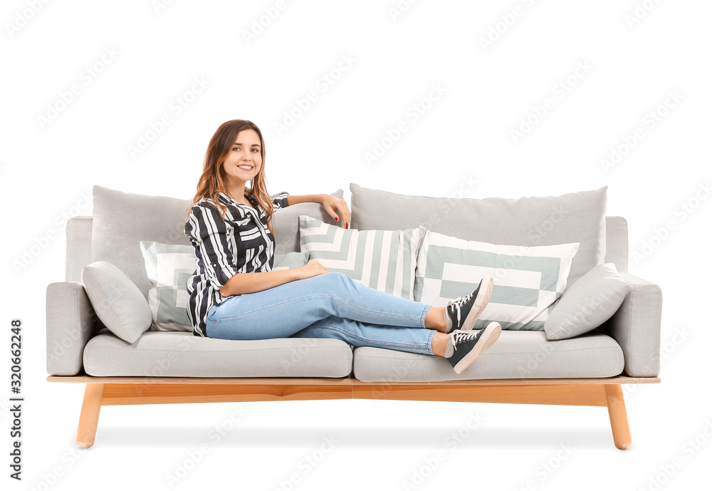 Young woman relaxing on sofa against white background Young woman relaxing on sofa against white background