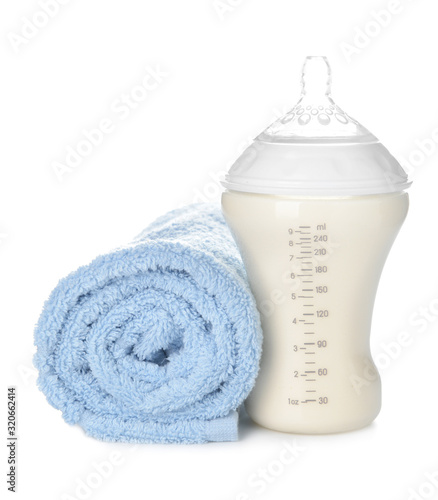 Baby bottle with milk and s...