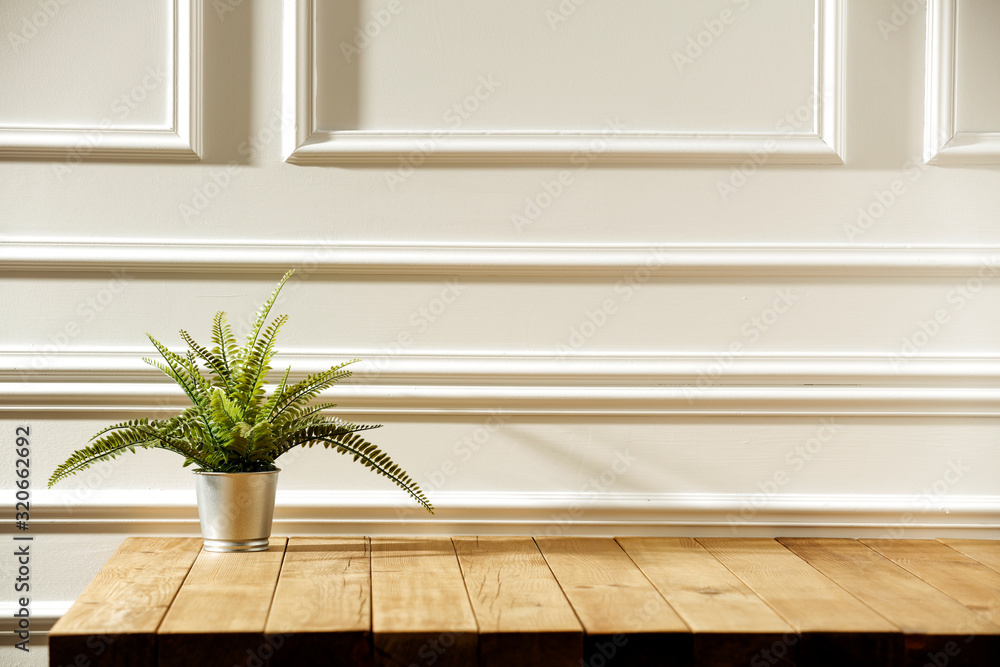 Desk of free space and white retro wall background. Desk of free space and white retro wall background.