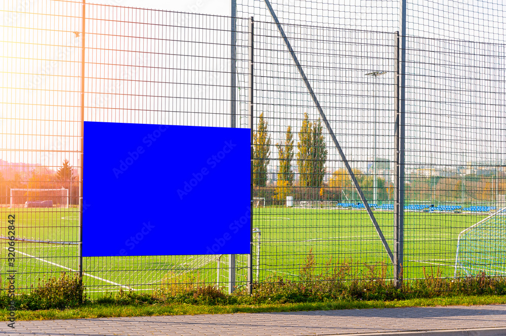 Advertising banner mockup on the fence of football/soccer court