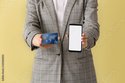Woman with credit card and ...