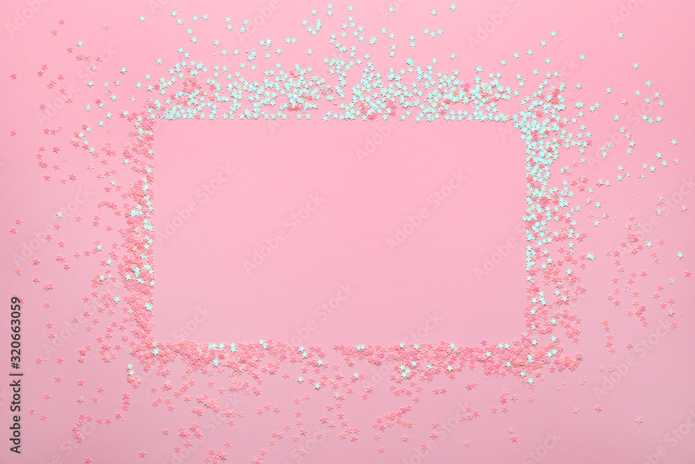 Frame made of glitters on pink background