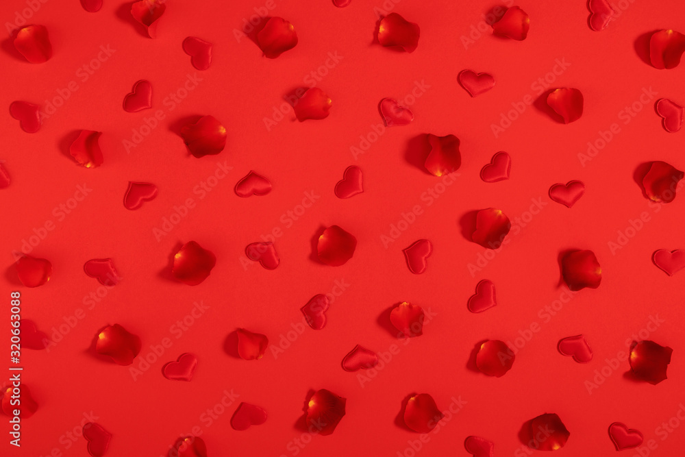 Valentine's Day red background. Beautiful red rose petals, hearts on red background. Valentine day concept. Flat lay, top view, copy space Valentine's Day red background. Beautiful red rose petals, hearts on red background. Valentine day concept. Flat lay, top view, copy space