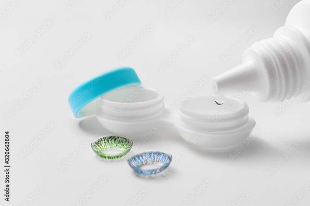 Contact lenses with case and solution on white background Contact lenses with case and solution on white background