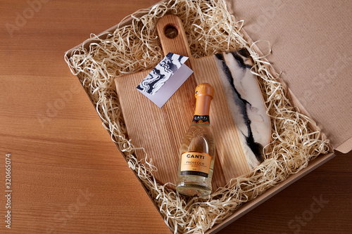 Fototapeta Exclusive painted art cutting board made of wood organic serving dishes with taste food cuisine bottle drink box present.