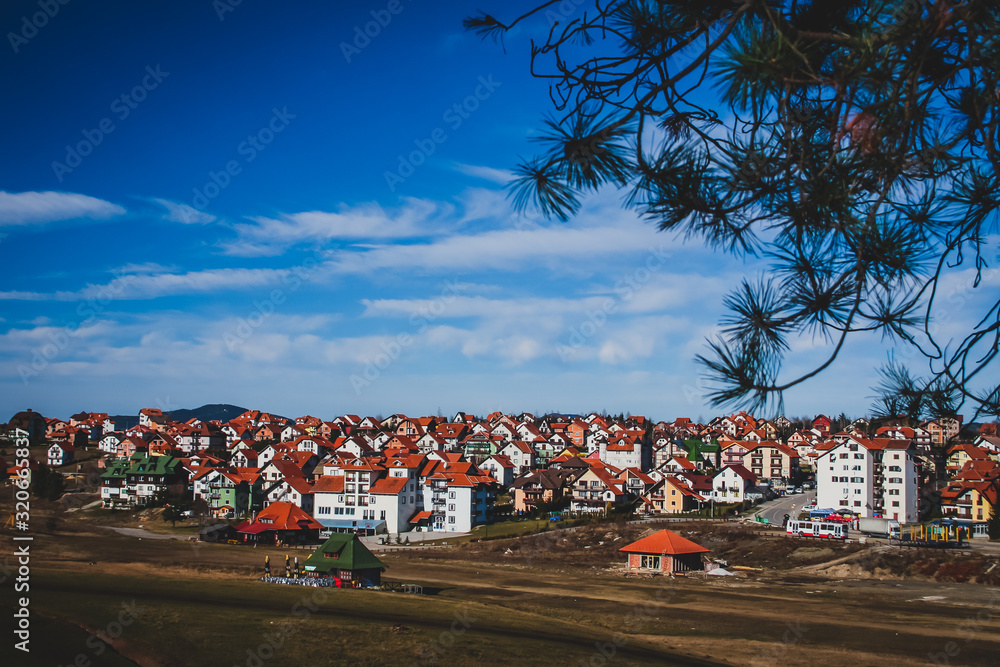 Panorama of the city of Zlatibor, tourist city in Serbia on a sunny and a little cloudy day in november.