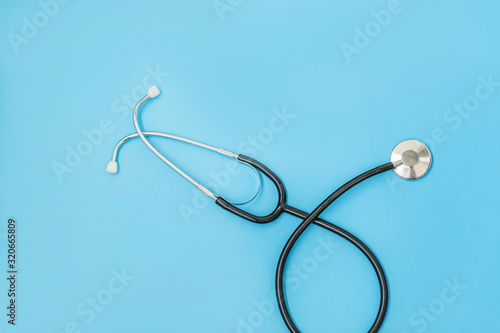 Medicine equipment stethoscope or phonendoscope isolated on trendy pastel blue background. Instrument device for doctor. Health care life insurance concept
