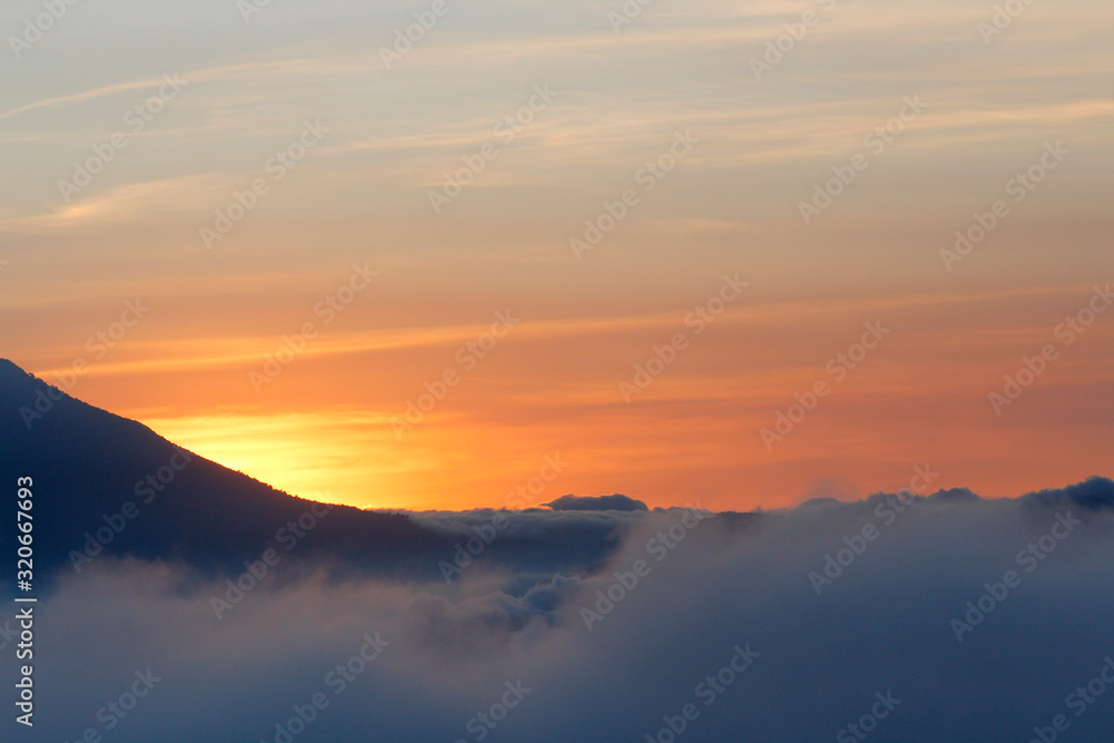 Beautiful sunset between clouds and mountains - landscapes in Guatemala
