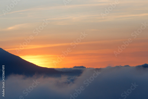 Beautiful sunset between clouds and mountains - landscapes in Guatemala
