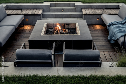 Outdoor zone for relax with burning fire pit photo