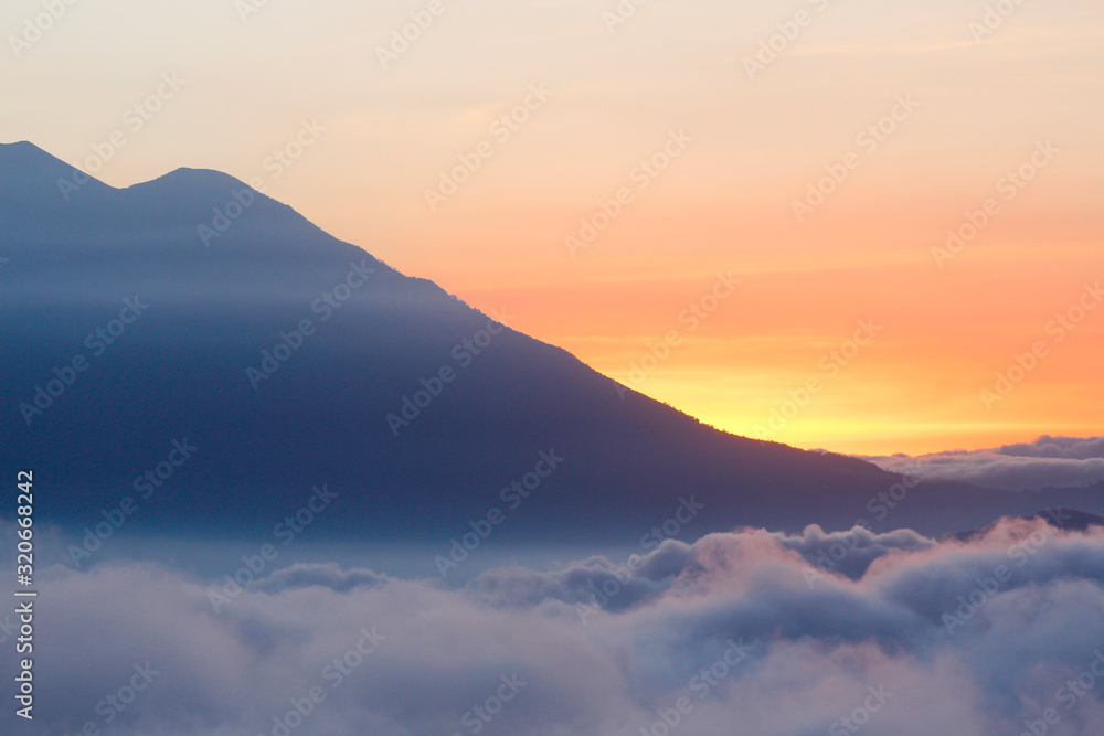 Sunset with colorful sky and many clouds over the mountains - landscapes in Guatemala
