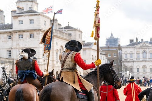 Mounted members of the English Civil War Society in historical costume, lead the parade to commemorate the execution of King Charles I