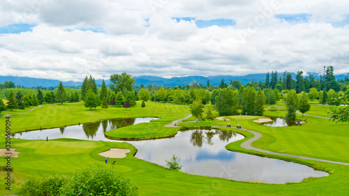 Golf course with gorgeous pond and fantastic forest view. 