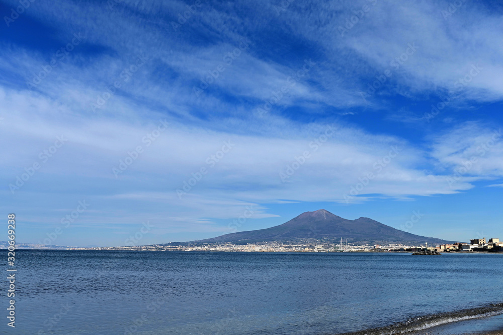 Naples and Mount Vesuvius Italy against a blue sky