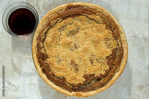 Freshly baked shoofly pie with molasses. Shoofly pie is a molasses pie or cake that developed its traditional form or recipe among the Pennsylvania Dutch in the 1880s.