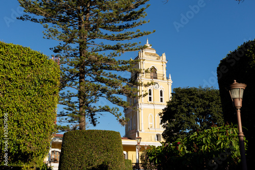 Huehuetenango central park with clock tower surrounded by trees - Guatemala cities - Latin American towns photo