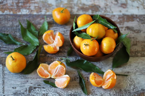 Fresh tangerines. Tangerine leaves. Vitamins Citruses.