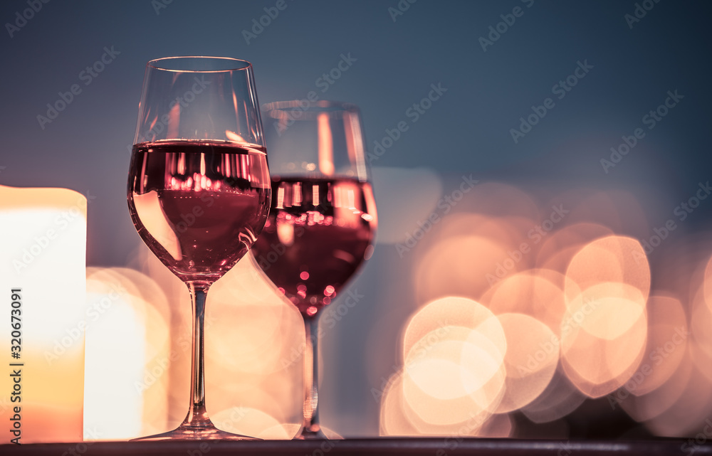 Candlelight dinner with wine and romantic city view