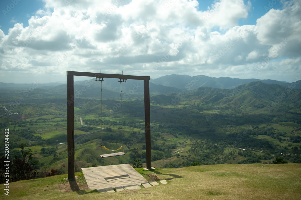Fototapeta premium Swing on top of the mountains