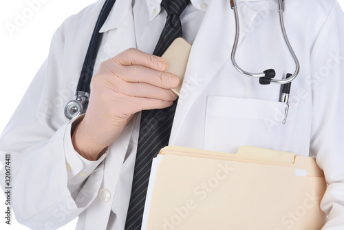 Εκτύπωση καμβά Closeup of a doctor placing his cell phone in his lab coats inside pocket