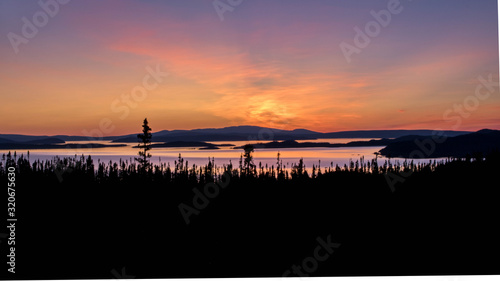 landscape of a sunset. Lake Manicouagan in Quebec. Mountain landscape with lake