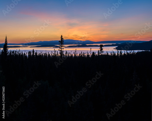 landscape of a sunset. Lake Manicouagan in Quebec. Mountain landscape with lake