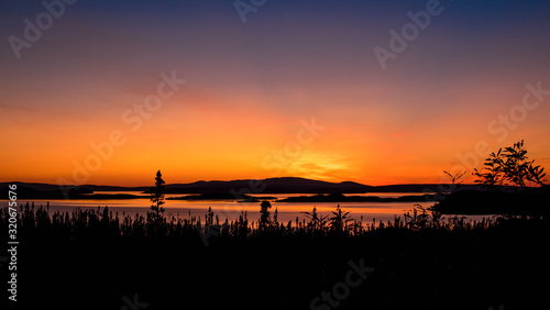 landscape of a sunset. Lake Manicouagan in Quebec. Mountain landscape with lake