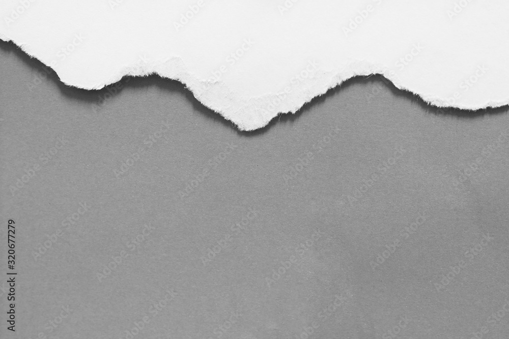 old torn paper on gray background with copy space for text old torn paper on gray background with copy space for text