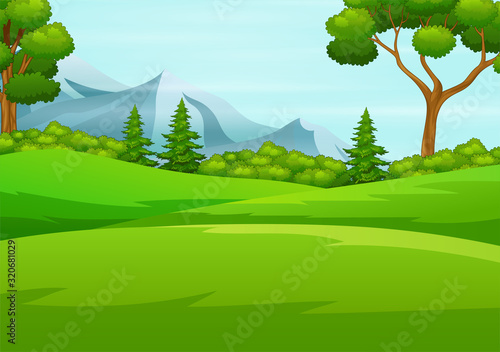 Beautiful green hills with big tree and mountains row on the horizon