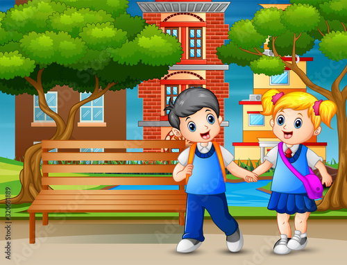 Happy school children walking pass through in park